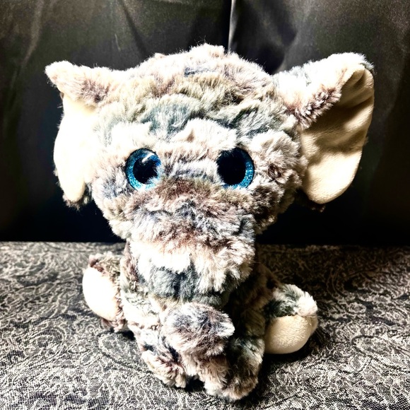 8" Multicolored elephant plushie with blue eyes. - Picture 1 of 8